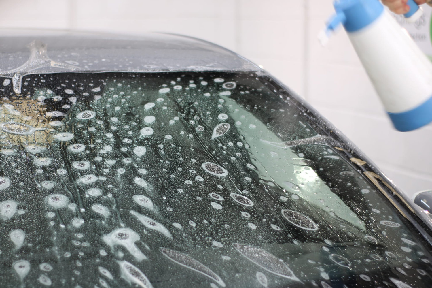 Windshield decontamination wash before film installation